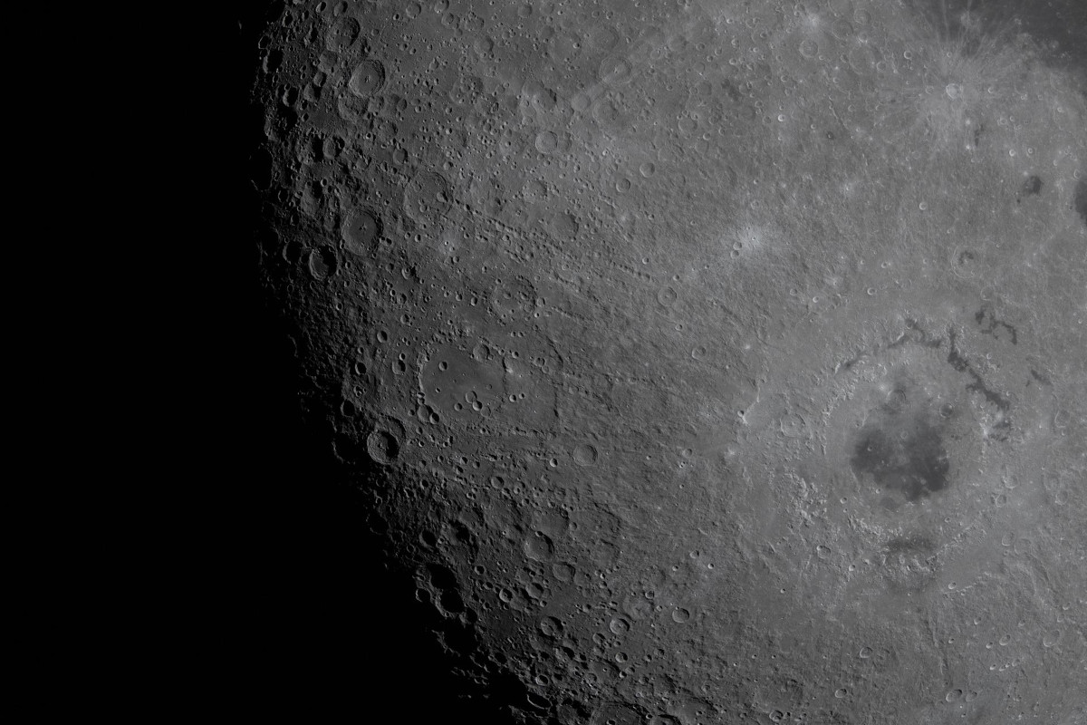 A picture of the moon's surface displaying a number of craters and basins.