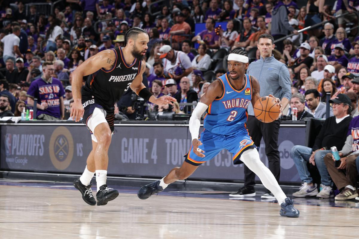 Oklahoma City Thunder guard Shai Gilgeous-Alexander (2) dribbles the ball past Phoenix Suns’ forward Dillon Brooks. Oklahoma City Thunder guard Shai Gilgeous-Alexander (2) dribbles the ball past Phoenix Suns’ forward Dillon Brooks.