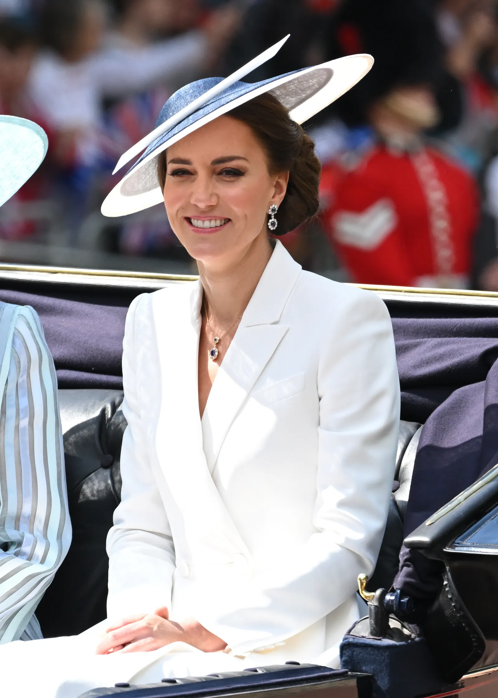 Image may contain Person Adult Accessories Jewelry Necklace Clothing Hat Head and Face