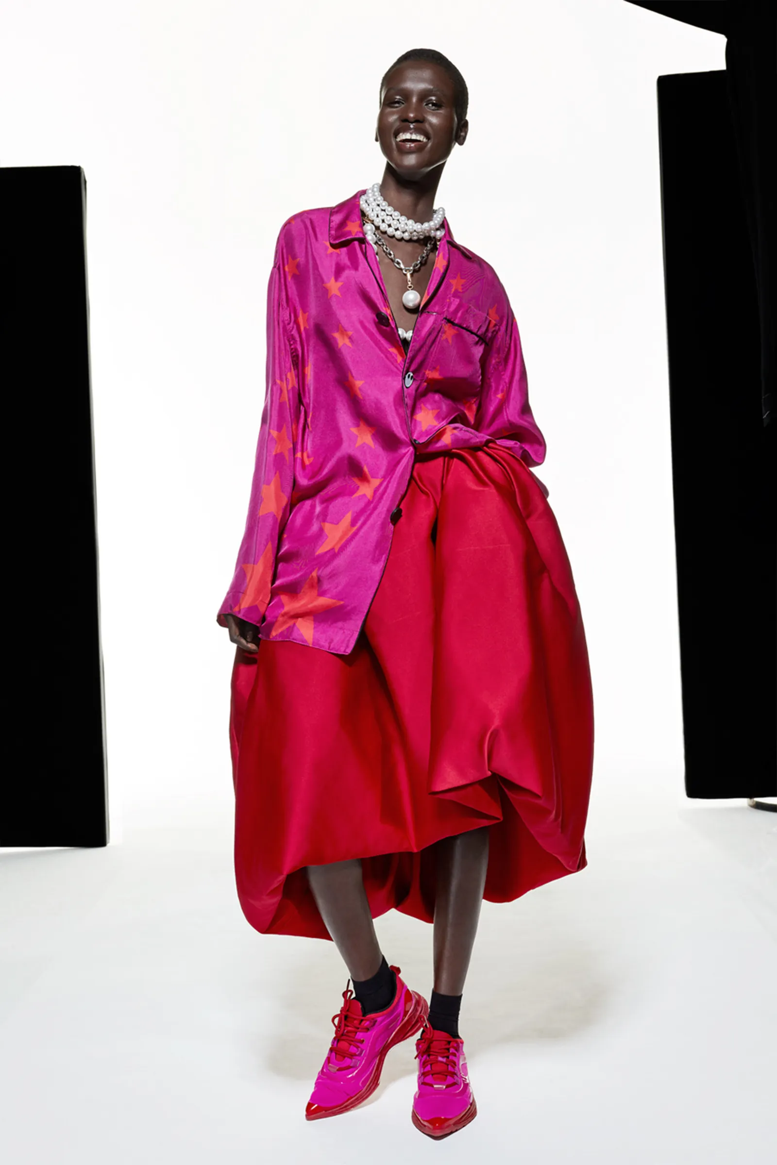 Image may contain Vivian Cheruiyot Coat Clothing Apparel Footwear Shoe Human Person Dress Sleeve and Fashion