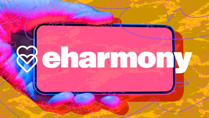 Hand holding phone with eharmony logo against abstract background
