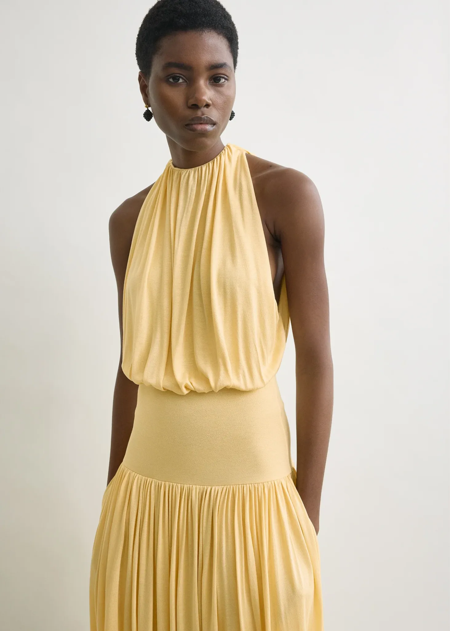 Image may contain Clothing Dress Evening Dress Formal Wear Blouse Adult Person Face and Head