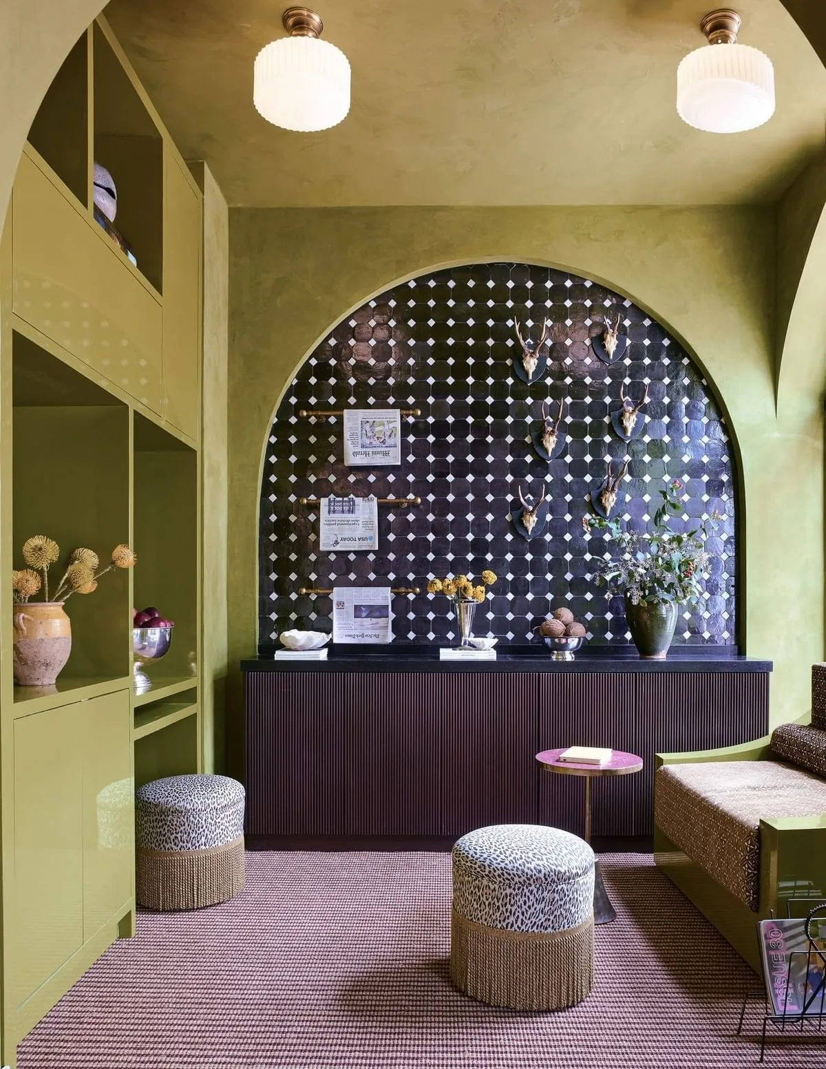 Image may contain Home Decor Chair Furniture Lamp Architecture Building Foyer Indoors Couch and Person