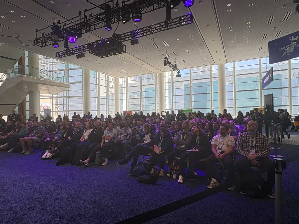 A crowd listens to the TDX session "Preview What's Next for Screen Flow"