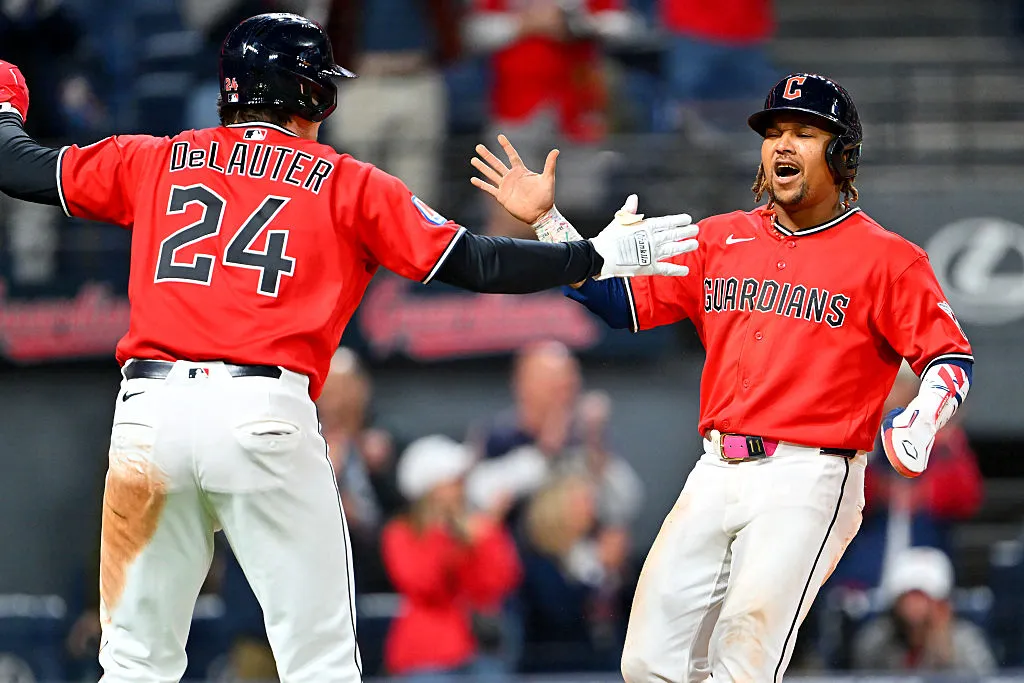 CLEVELAND, OHIO - APRIL 21: Chase DeLauter #24 and José Ramírez #11 of the Cleveland Guardians celebrate scoring during the eighth inning against the Houston Astros at Progressive Field on April 21, 2026 in Cleveland, Ohio. The Guardians defeated the Astros 5-8. (Photo by Jason Miller/Getty Images)