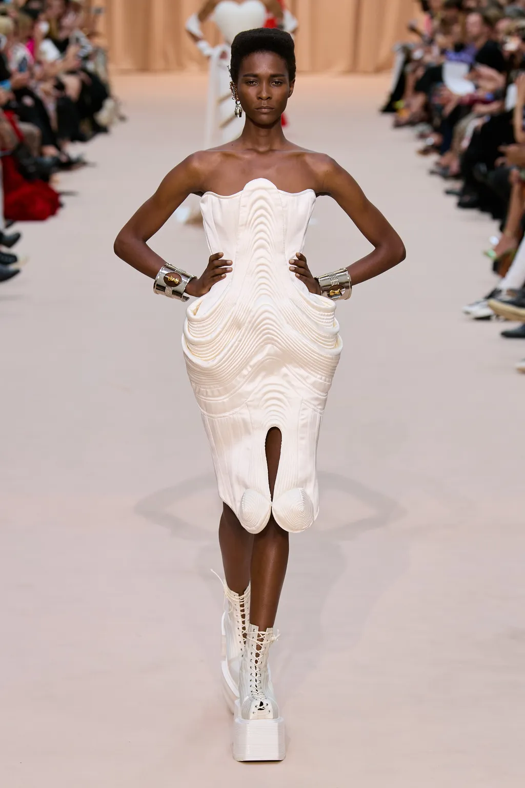 Image may contain Clothing Evening Dress Gown Apparel Robe Fashion Human Person Runway Shoe and Footwear