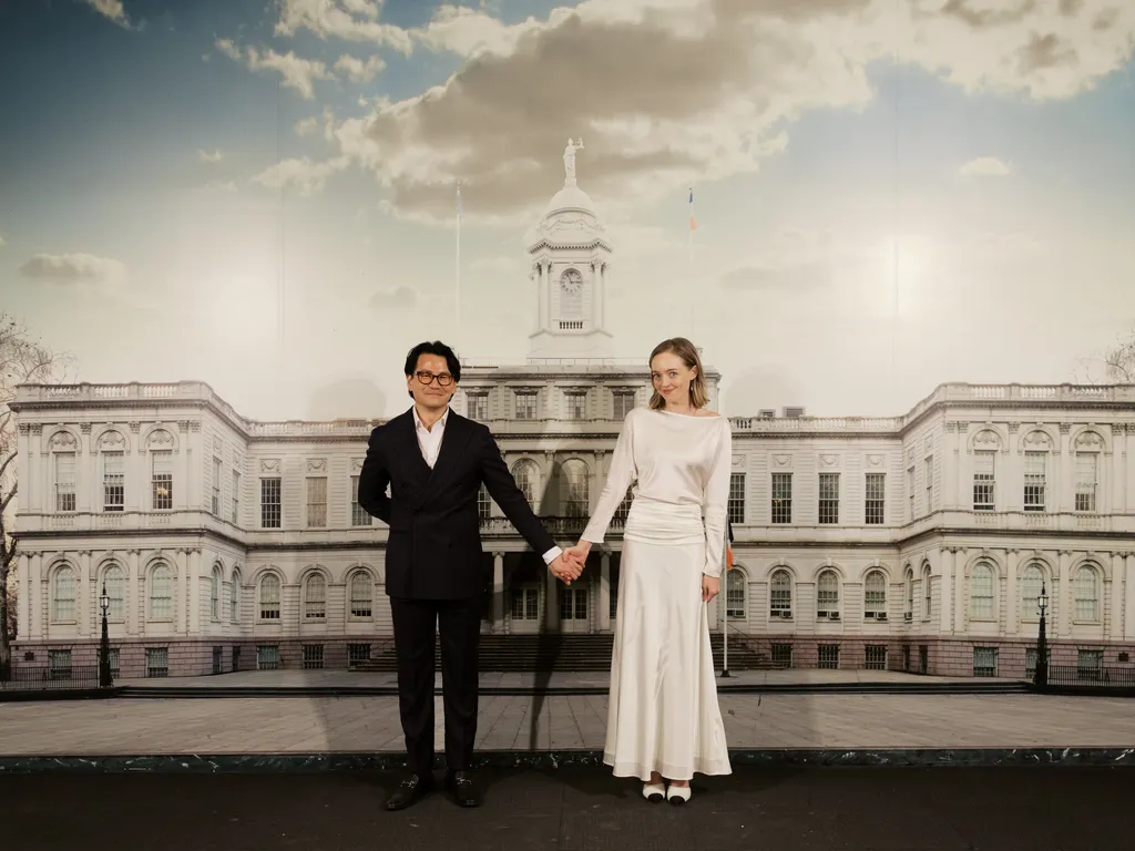 Image may contain Body Part Hand Person Holding Hands Adult Wedding Clothing and Coat