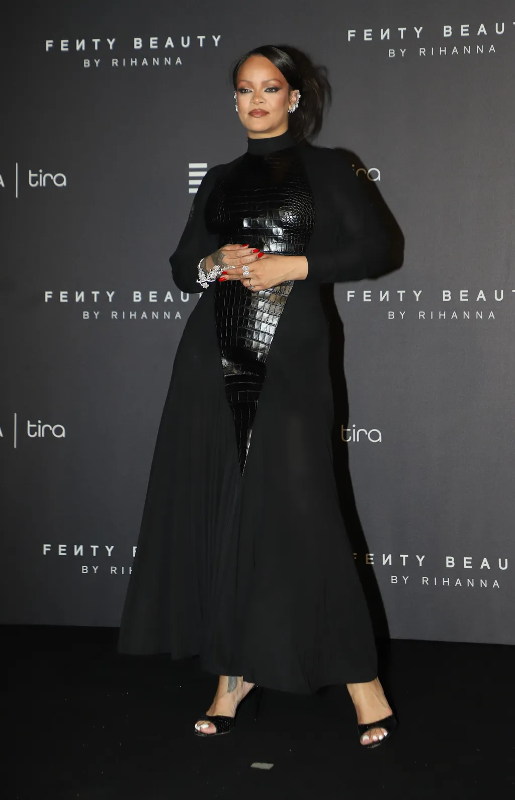 Image may contain Rihanna Adult Person Black Hair Hair Clothing Long Sleeve Sleeve Dress Fashion and Formal Wear