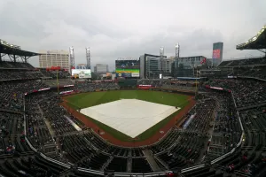 May 22, 2023; Atlanta, Georgia, USA; The tarp covers the field at Truist Park during a rain delay before a game between the Atlanta Braves and Los Angeles Dodgers. Mandatory Credit: Brett Davis-USA TODAY Sports