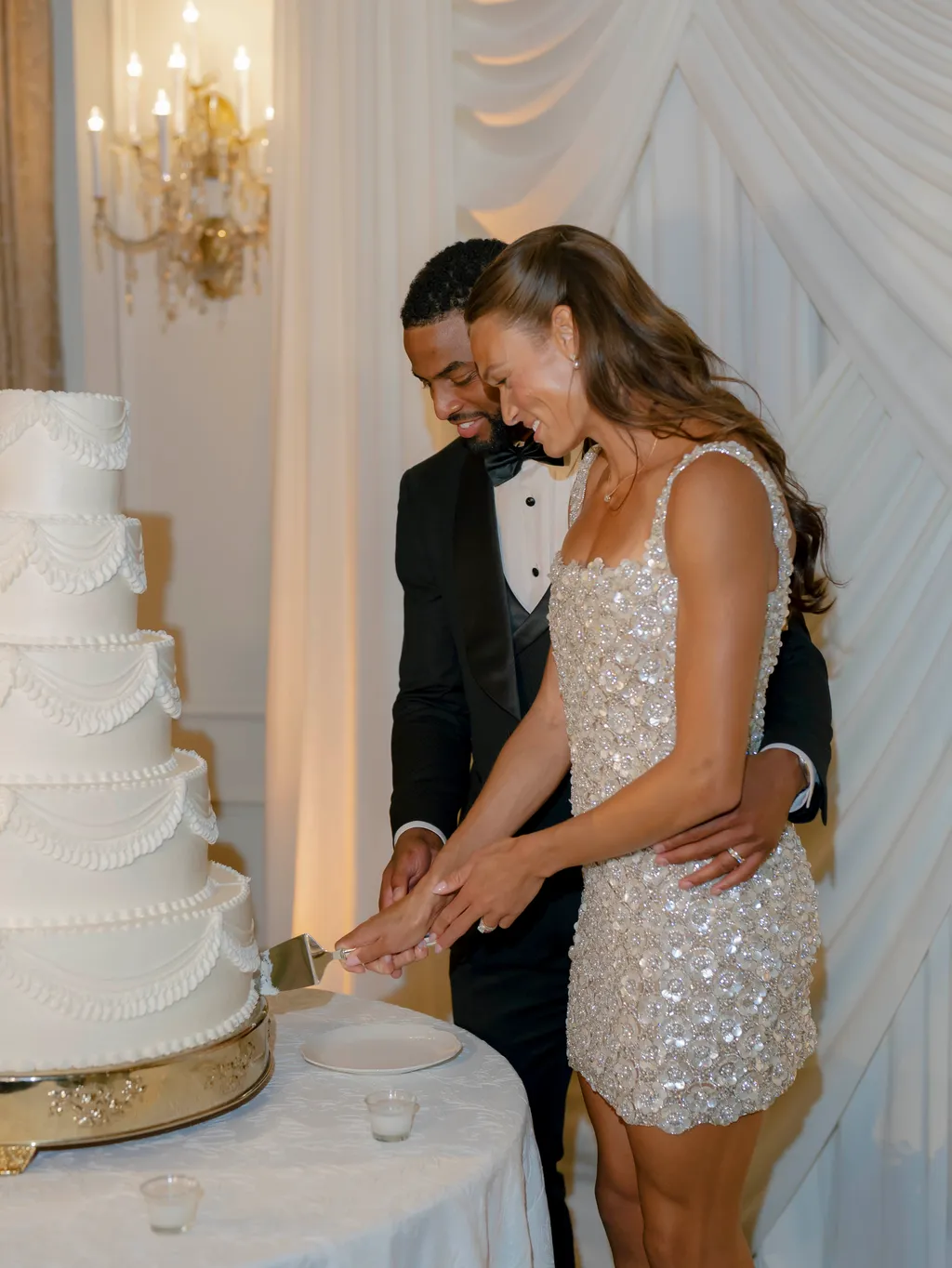 Image may contain Wedding Adult Person Cake Dessert Food Wedding Cake Clothing Dress and People