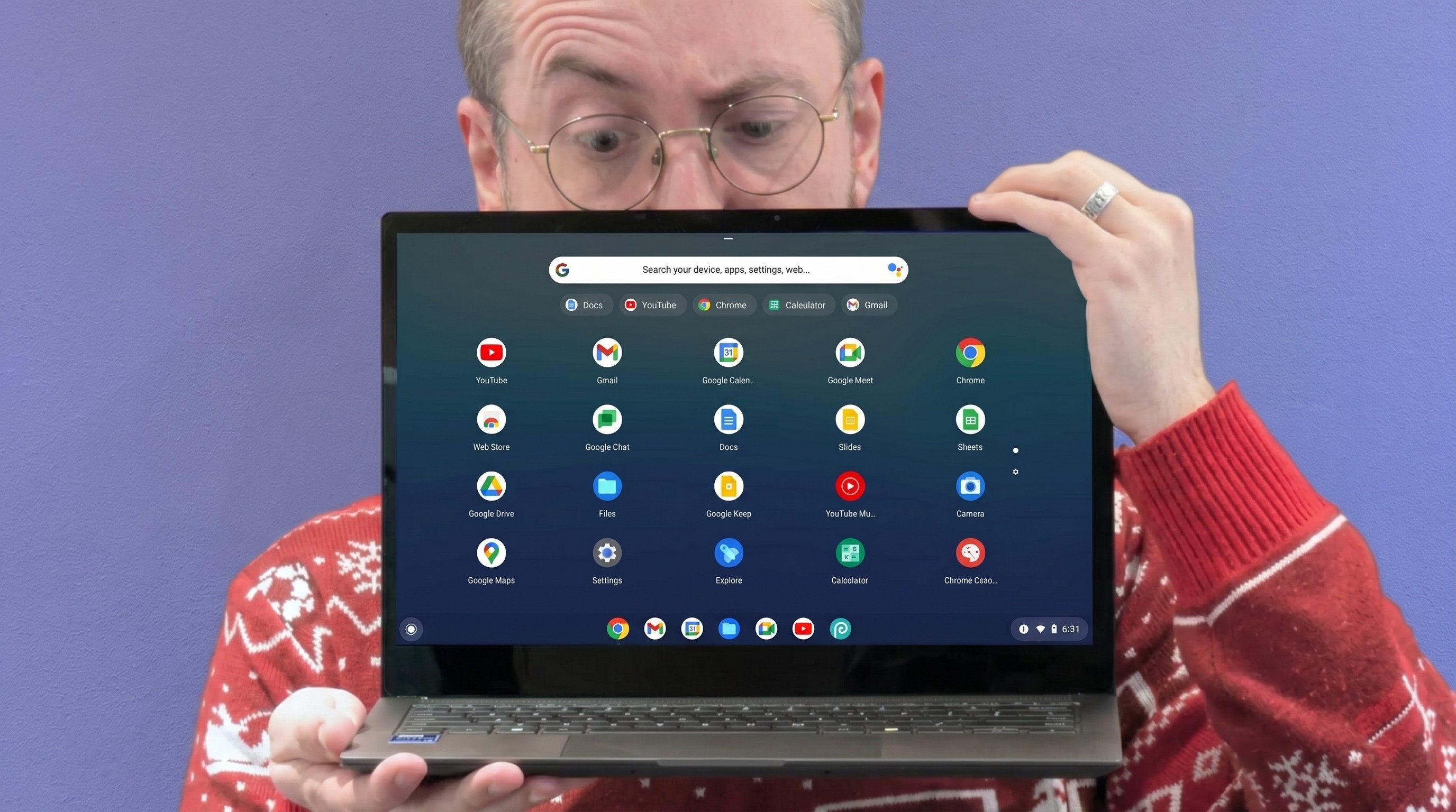 A person with glasses holds a laptop displaying a colorful app interface against a purple background. They appear surprised or intrigued.