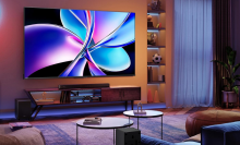 living room with Hisense QD7 TV mounted on wall