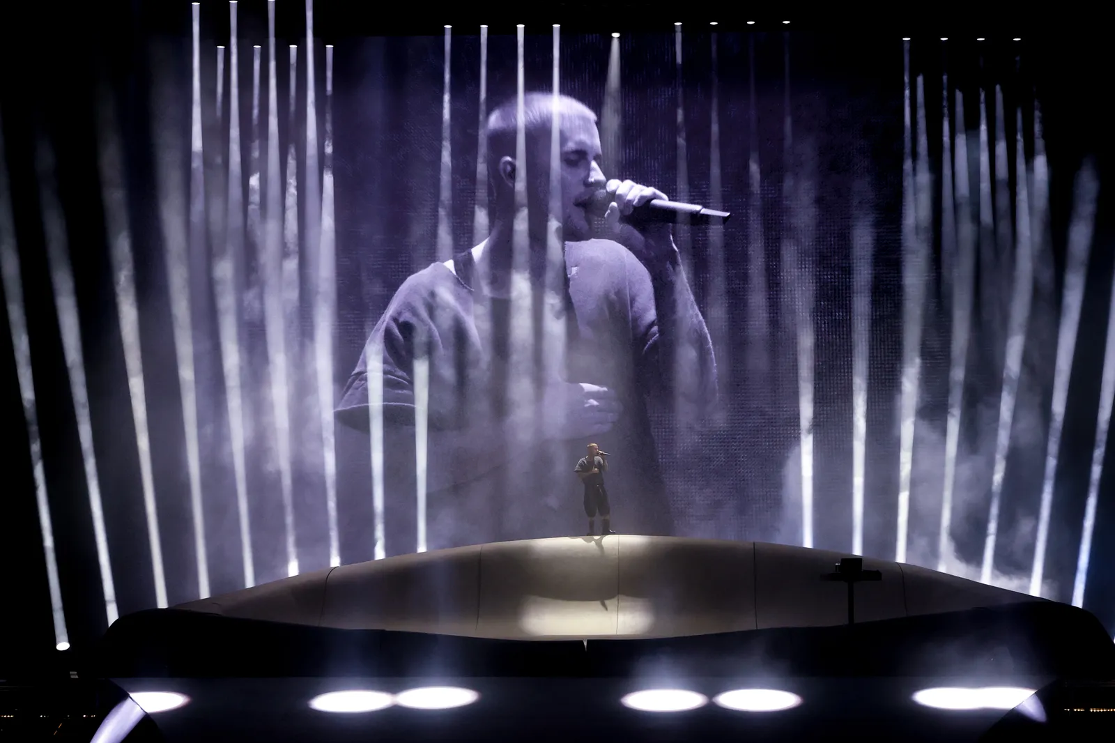 Image may contain Lighting Electrical Device Microphone Performer Person Solo Performance Adult Stage and Concert