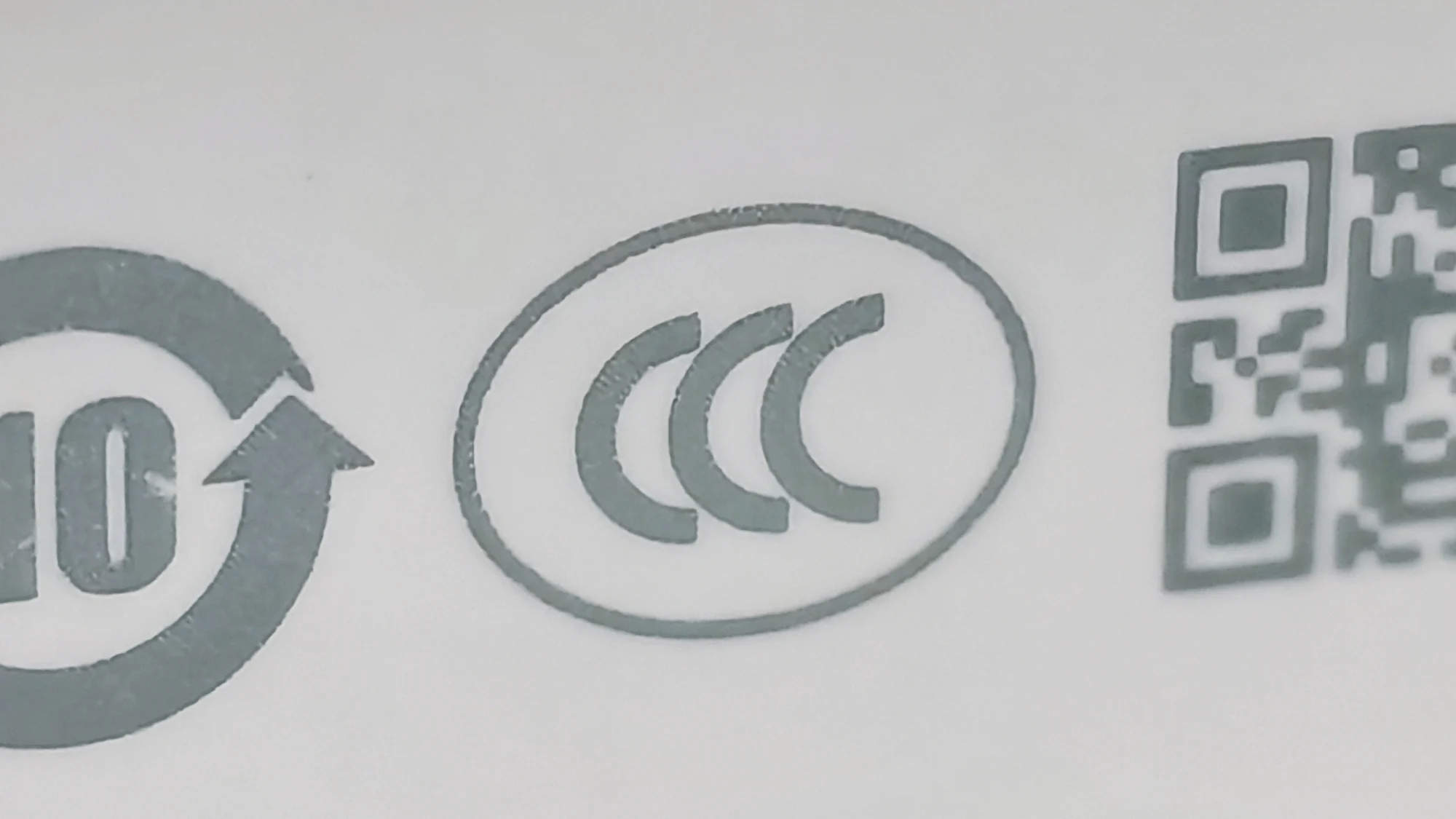 The CCC certification mark printed on a white power bank.