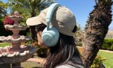 person sitting outside wearing soundcore space 2 headphones