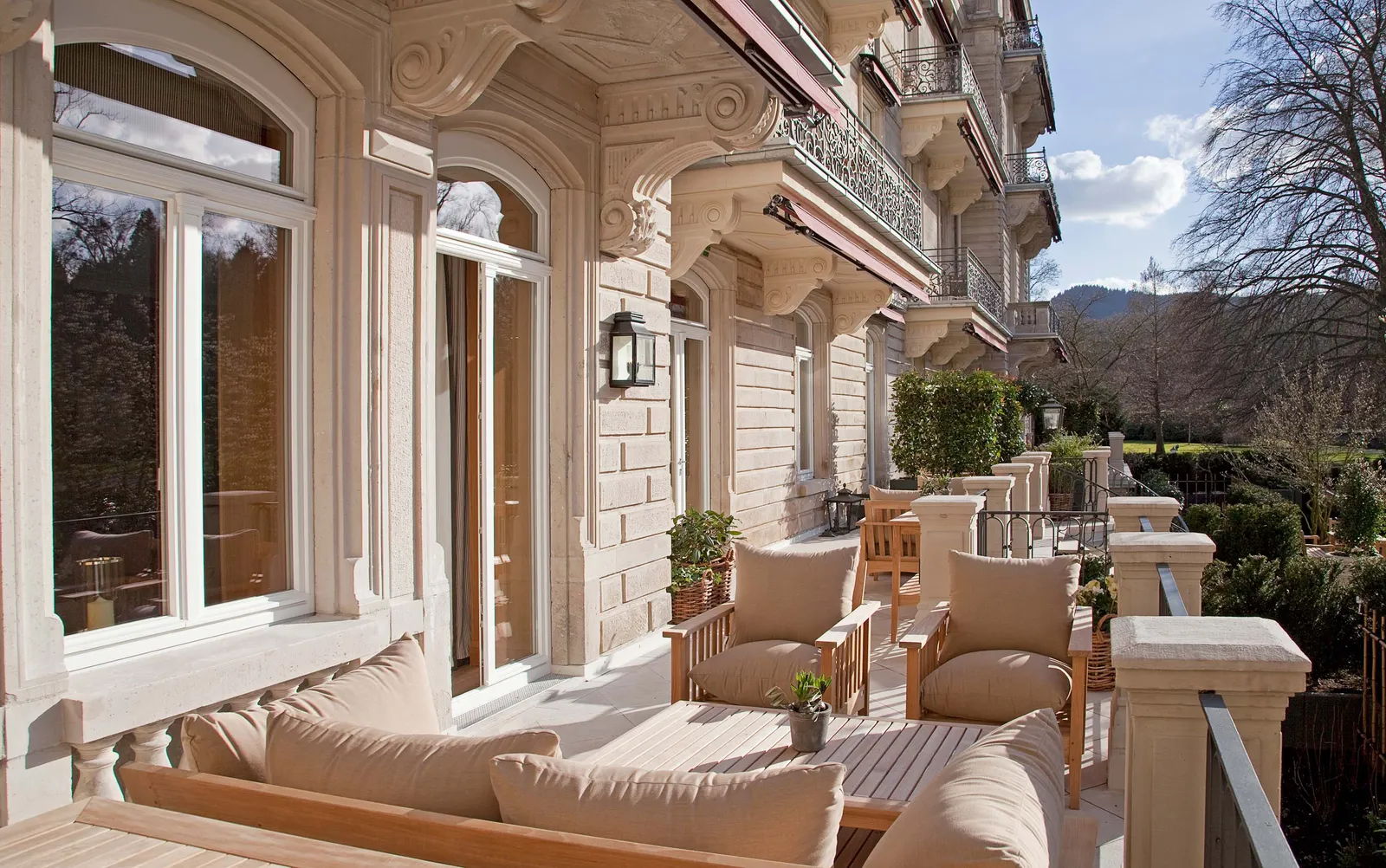 Image may contain Plant Architecture Building Housing House Portico Chair and Furniture