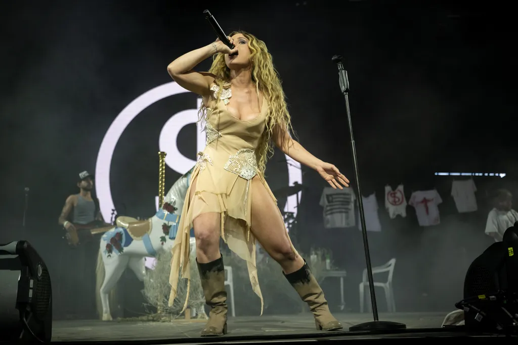 Image may contain Performer Person Solo Performance Adult Gun Weapon Clothing Footwear and Shoe