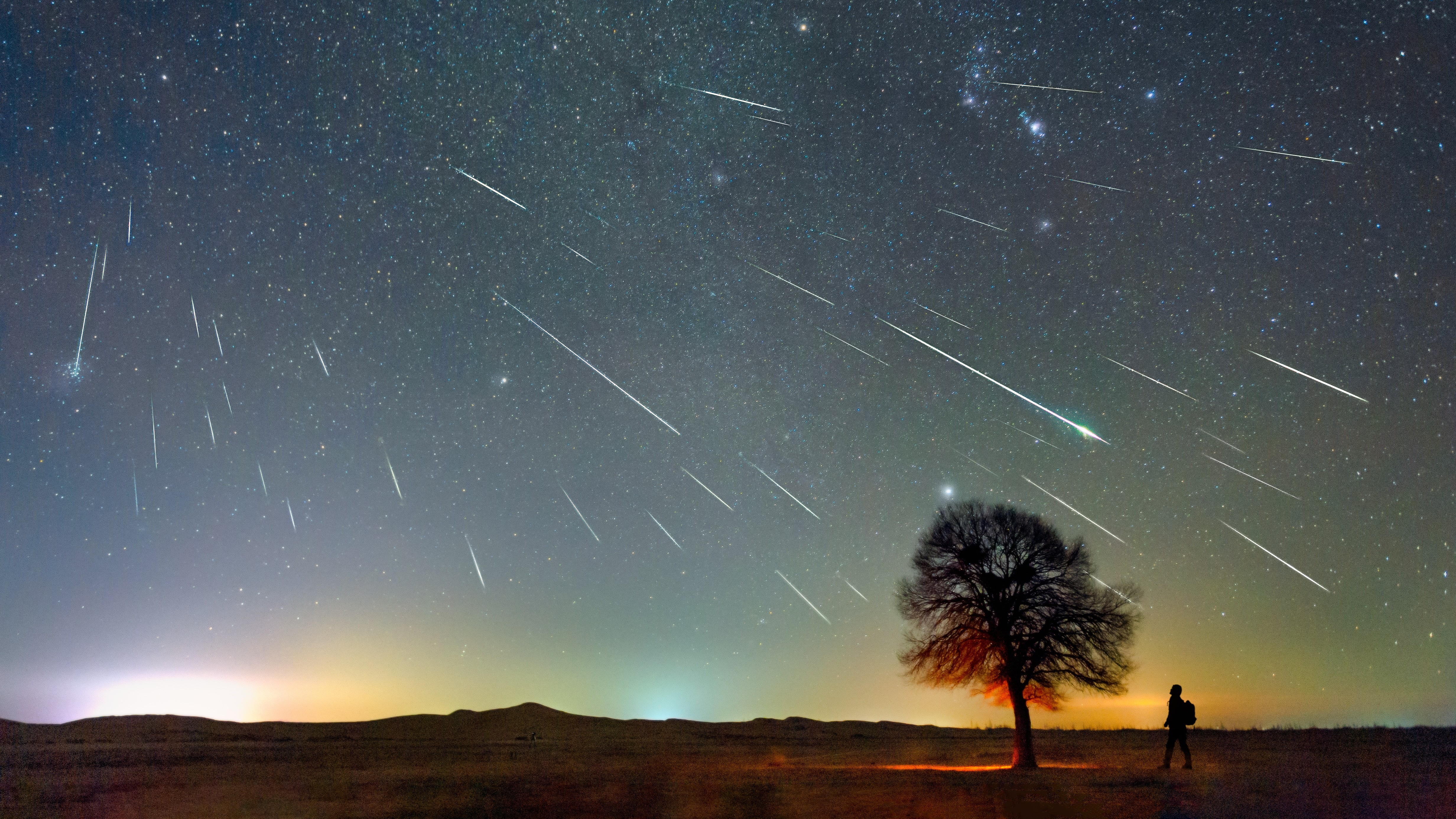 A photo of the Geminid meteor shower in the Kubuqi Desert of Inner Mongolia, China. 