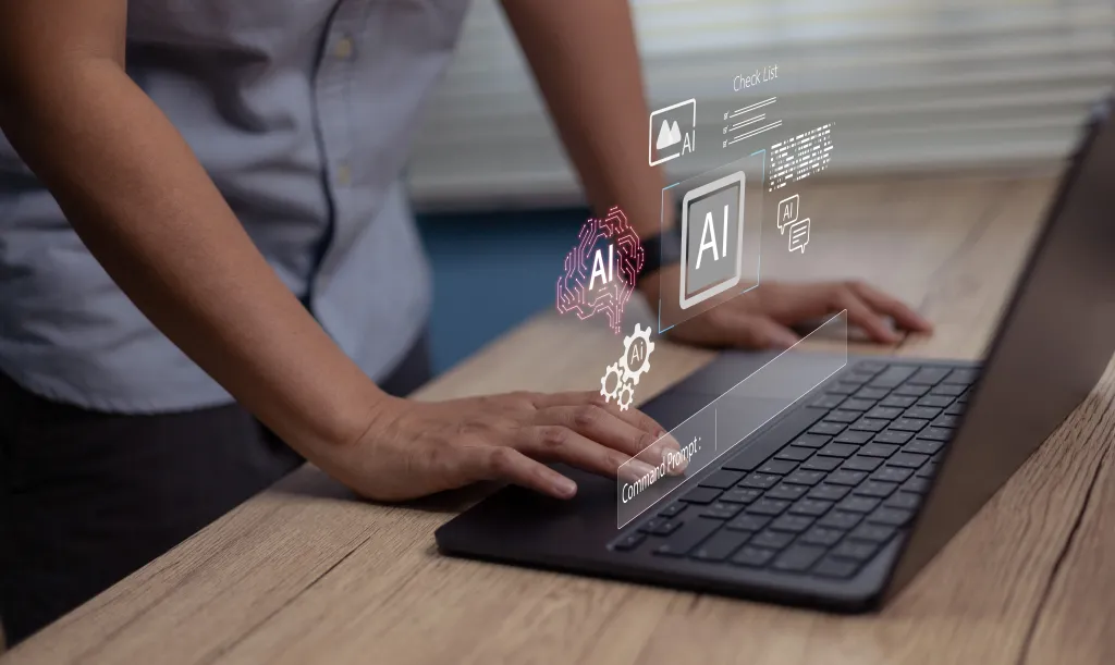 Person using a laptop with virtual AI interface elements including a brain icon and a command prompt.