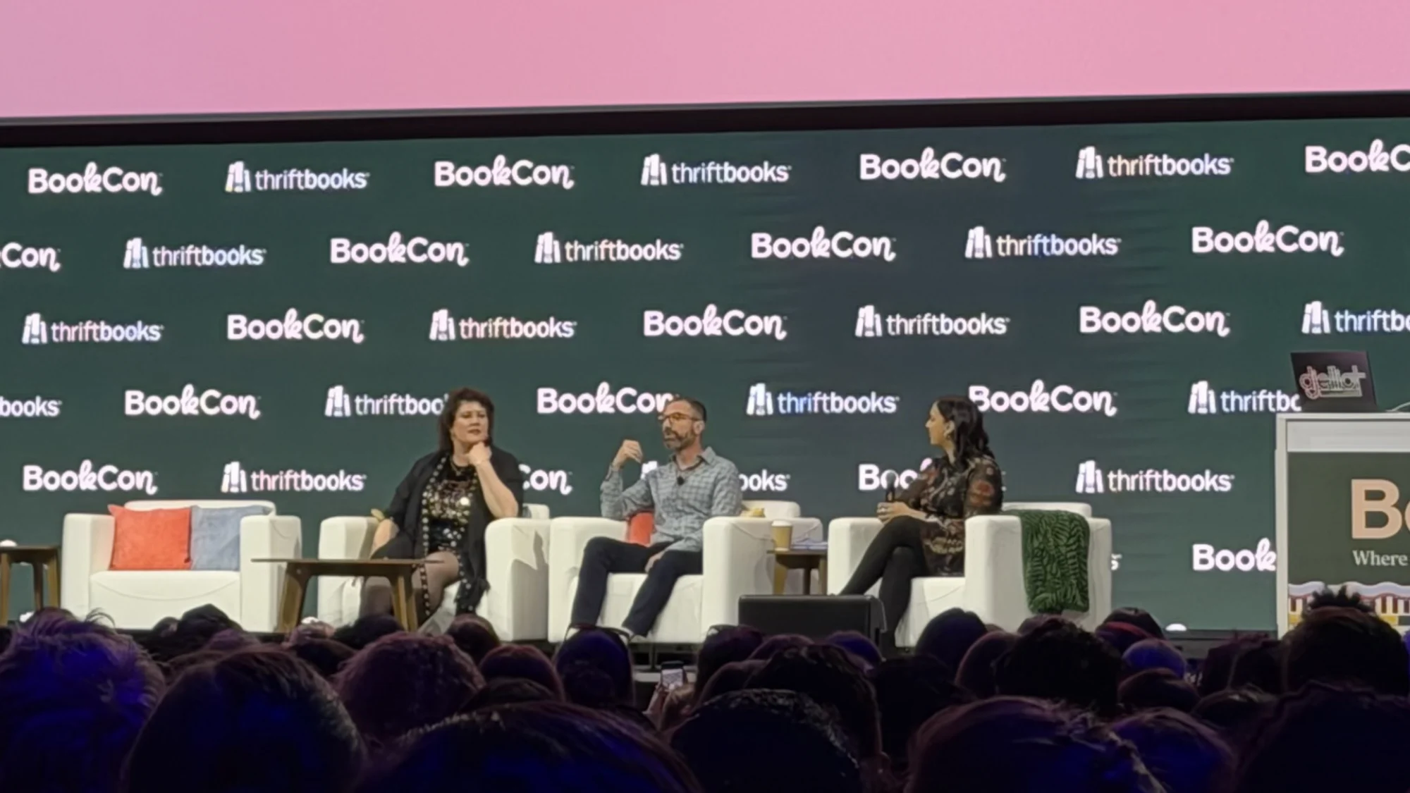 Rachel Reid, Jacob Tierney, and Versha Sharma on stage at BookCon