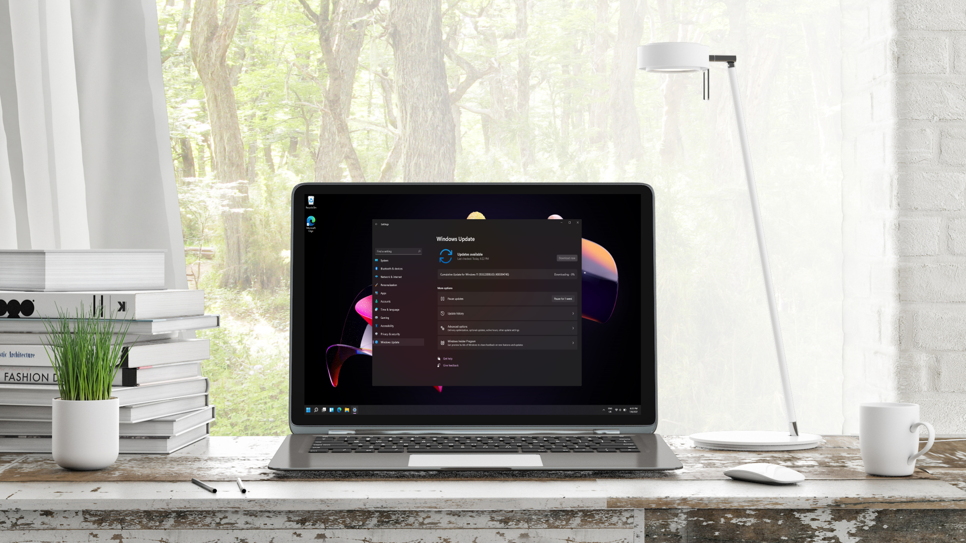 Windows 11 Update panel showing on laptop on a desk
