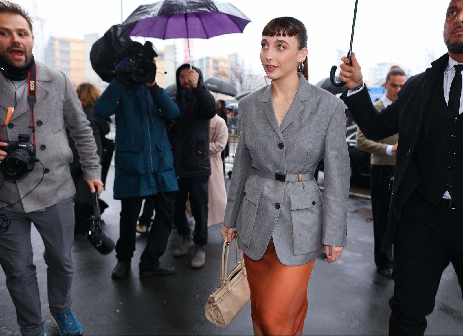 Image may contain Emma Chamberlain Clothing Coat Accessories Bag Handbag Blazer Jacket Formal Wear Suit and Adult